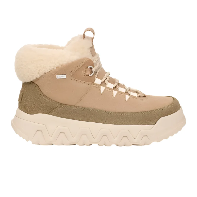 Stylish boots with faux leather construction for a cruelty-free optionUgg Women's TerreTrail Cozy Lace Boot Sand