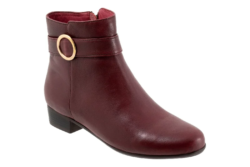 Stylish boots with polished metal accents for a refined lookMelody