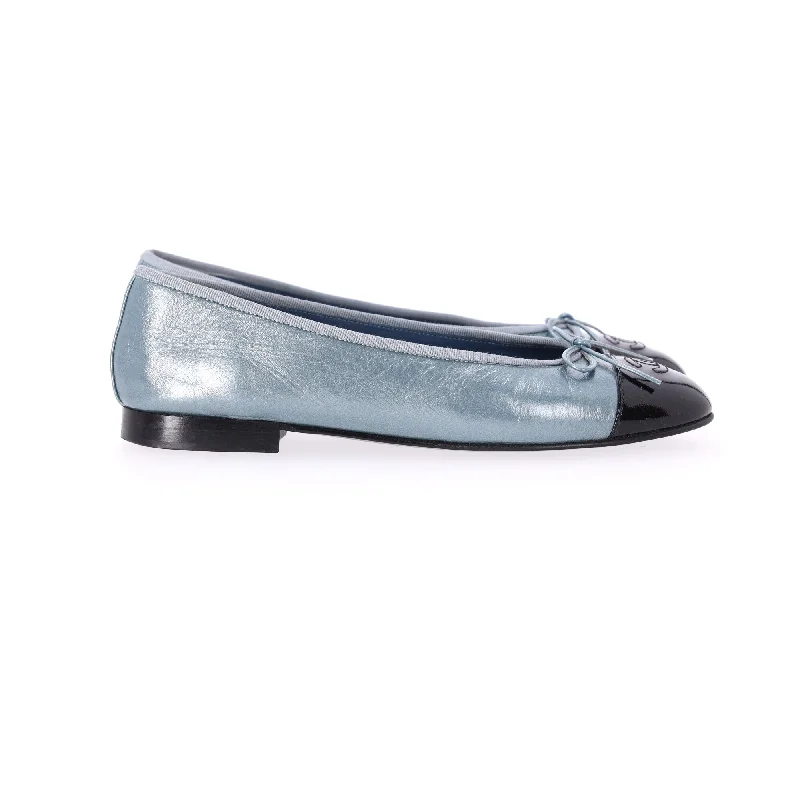 Trendy flats with layered ruffles for a feminine touchComfortable flats for a trendy yet relaxed lookChanel Cap Toe CC Ballet Flats in Light Blue Leather